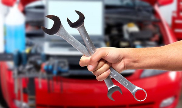 37862914 - hand of car mechanic with wrench.