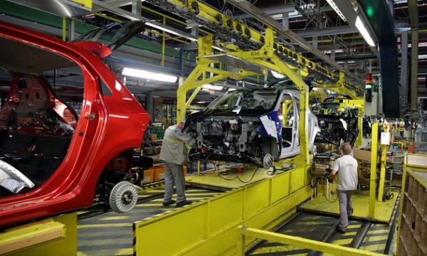 Workers assemble new Renault Smart For Four automobiles as they pass along the production line at the Renault Revoz d.d. plant, a unit of Renault SA, in Novo Mesto, Slovenia, on Friday, 19 June, 2015. European car sales rose at the slowest pace in six months in May as buyers' concerns about unemployment and the Greek sovereign debt crisis held back demand at Volkswagen AG and Renault SA. Photographer: Oliver Bunic/Bloomberg